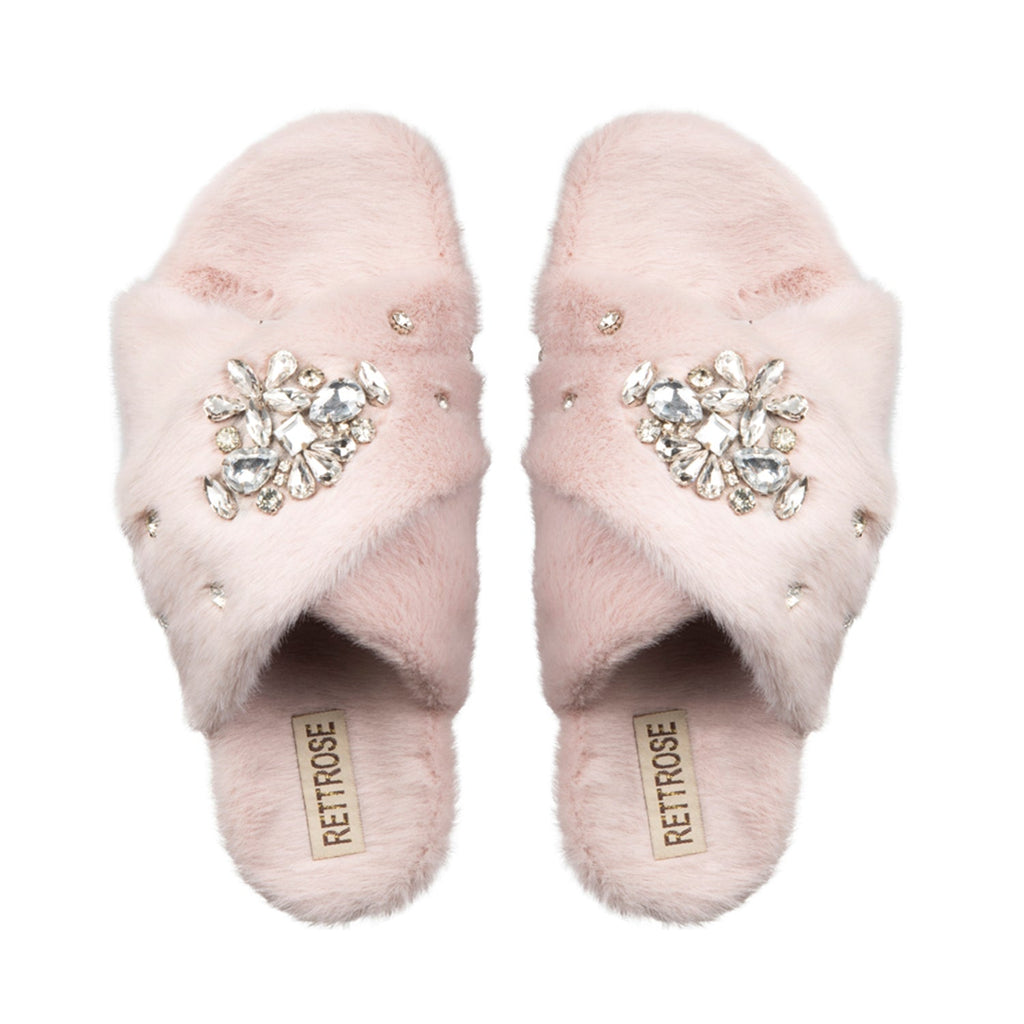 A pair of dusky pink luxury plush slippers with diamanté embellishments and a hand-held love appliqué.